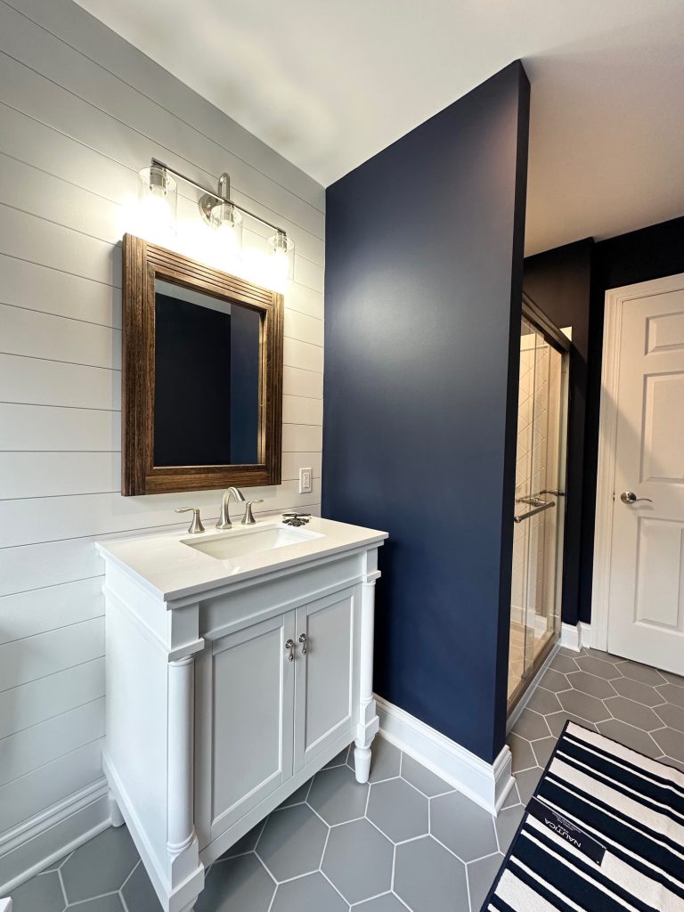 mirror in bathroom with washbasin and with storage area