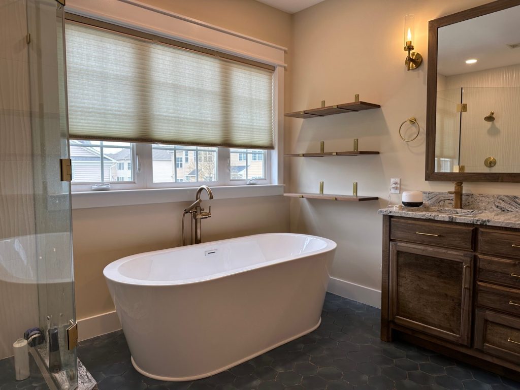a clean beautiful bath area with bathtub