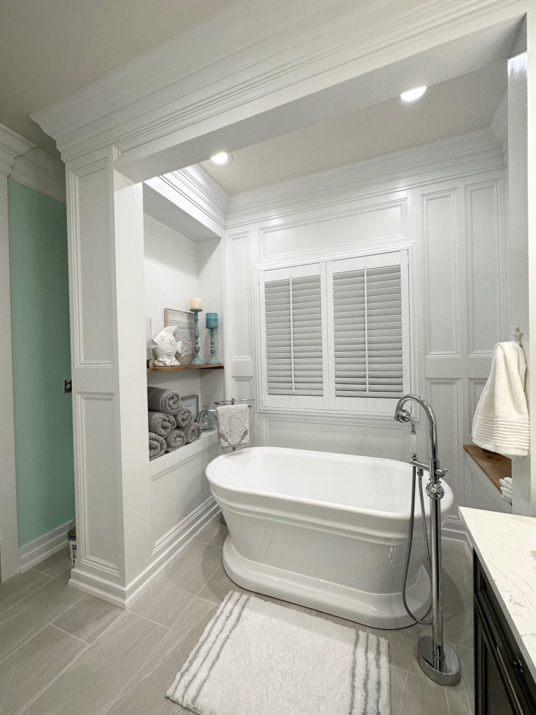 a clean beautifull bath area with bathtub