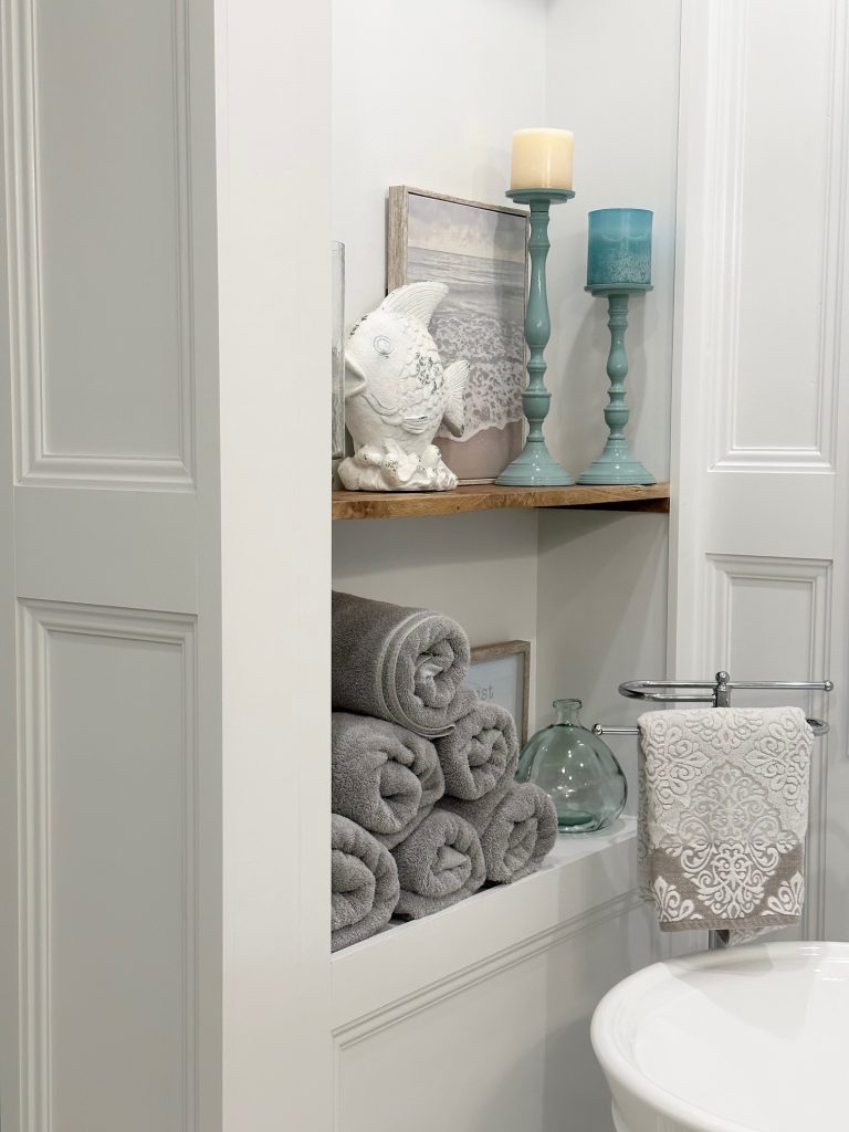 storage area for towels in bathroom
