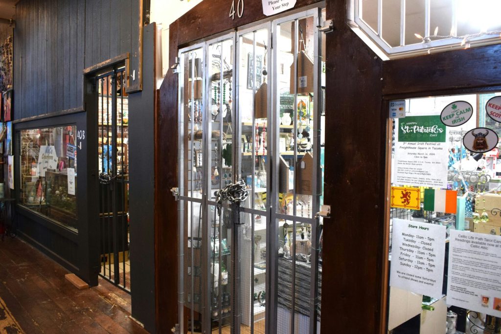 a store front with glass doors and a wooden floor