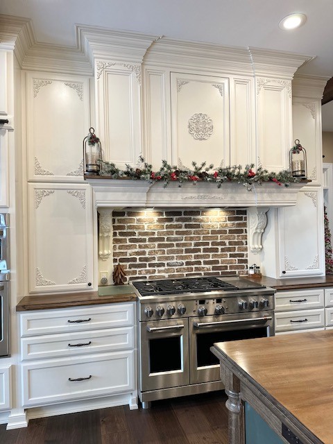 Elegant kitchen with brick backsplash
