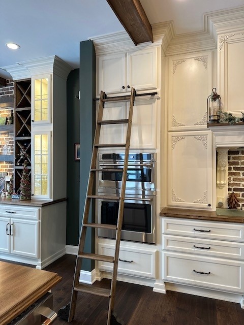 Ladder against kitchen cabinets